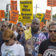 Lesley McSpadden (second from left) and Michael Brown Sr. (center), parents of Michael Brown, participate in a protest march for their son Aug. 30, 2014, in Ferguson, Mo.
Aaron P. Bernstein/Getty Images